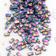 Load image into Gallery viewer, Opaque Purple Grey Rainbow Luster Half Tila Beads
