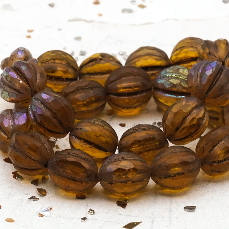10mm Amber with Matte and AB Finishes with a Metallic Brown Wash Faceted Melon Bead Strand