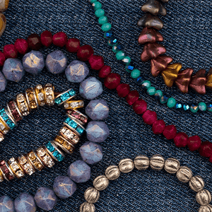 //nostalgica.com/cdn/shop/files/Circle_Web_Banners_Beads_300x300.png?v=1663124439