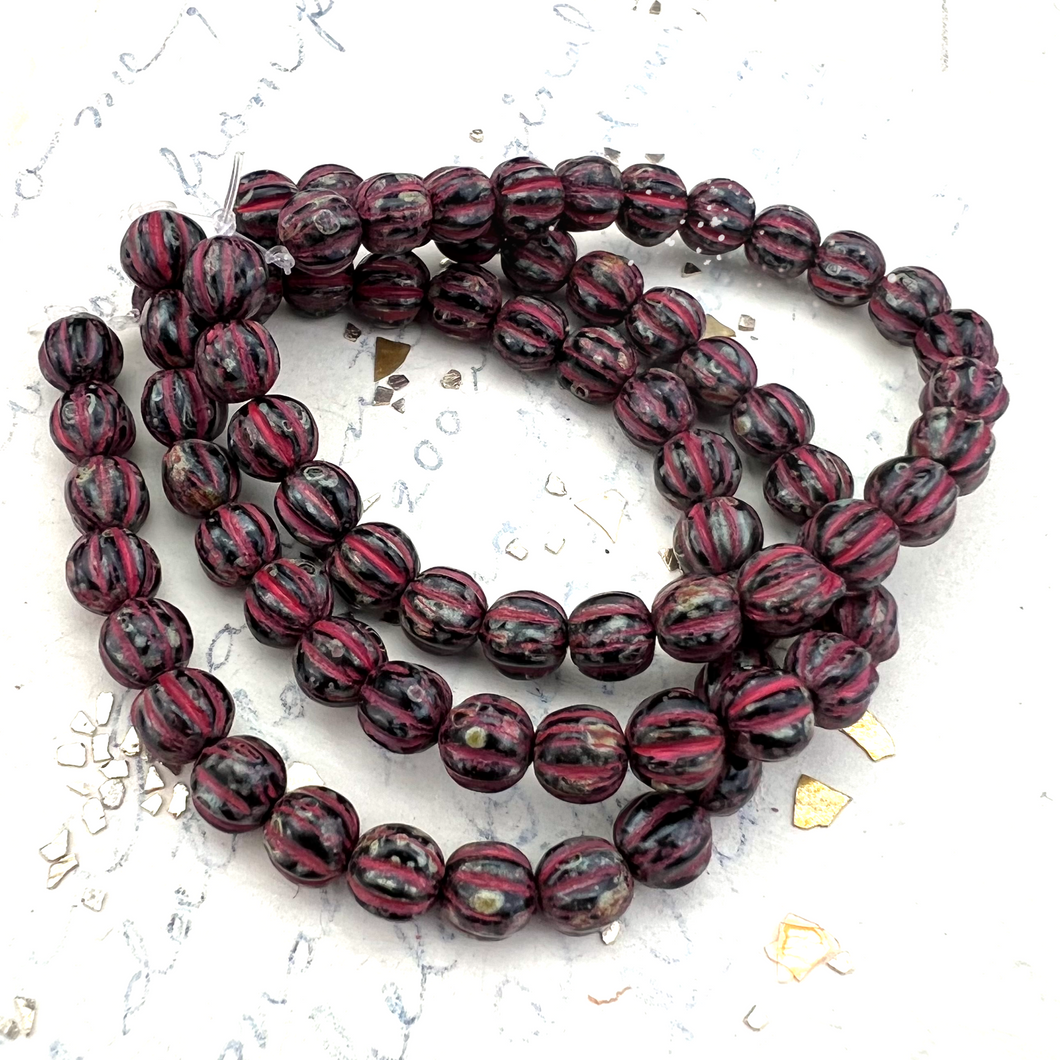 5mm Black with Picasso and Red Wash Melon Bead Strand