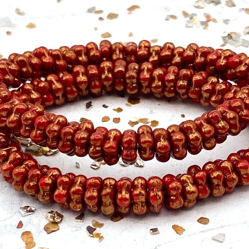 5mm Opaque Scarlet Red with a Gold Finish Forget-Me-Not Spacer Strand