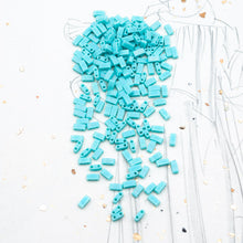 Load image into Gallery viewer, Matte Opaque Turquoise AB Half Tila Beads
