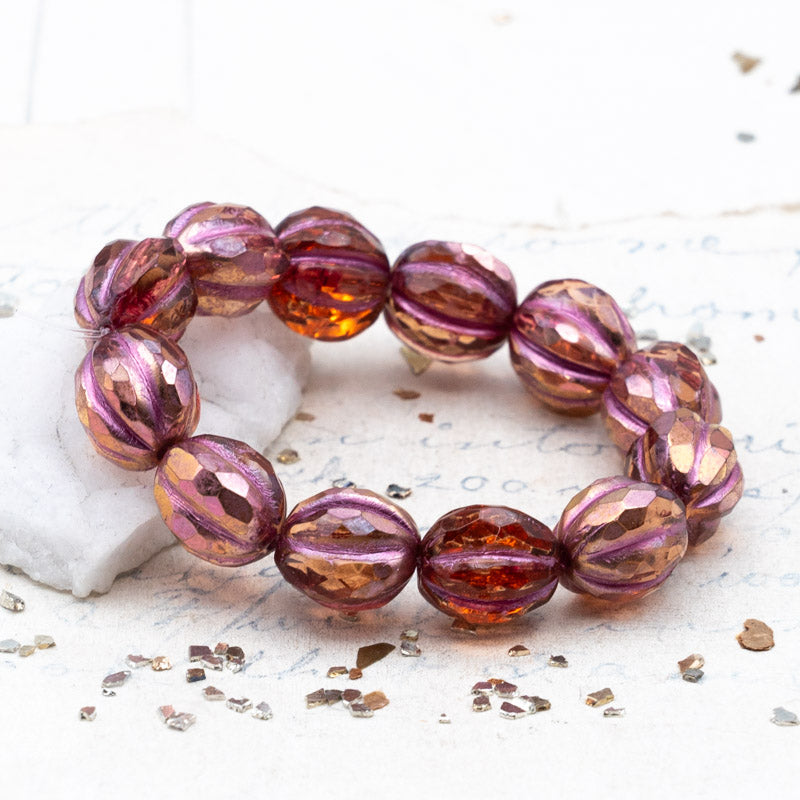 10mm Transparent Peach with a Copper Rainbow Finish and a Metallic Pink Wash Faceted Melon Bead Strand