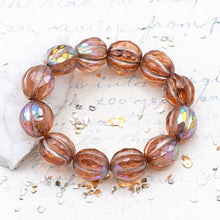 Load image into Gallery viewer, 10mm Peach with a Copper Rainbow Finish and a Metallic Pink Wash Faceted Melon Bead Strand
