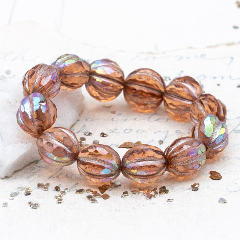 10mm Peach with a Copper Rainbow Finish and a Metallic Pink Wash Faceted Melon Bead Strand