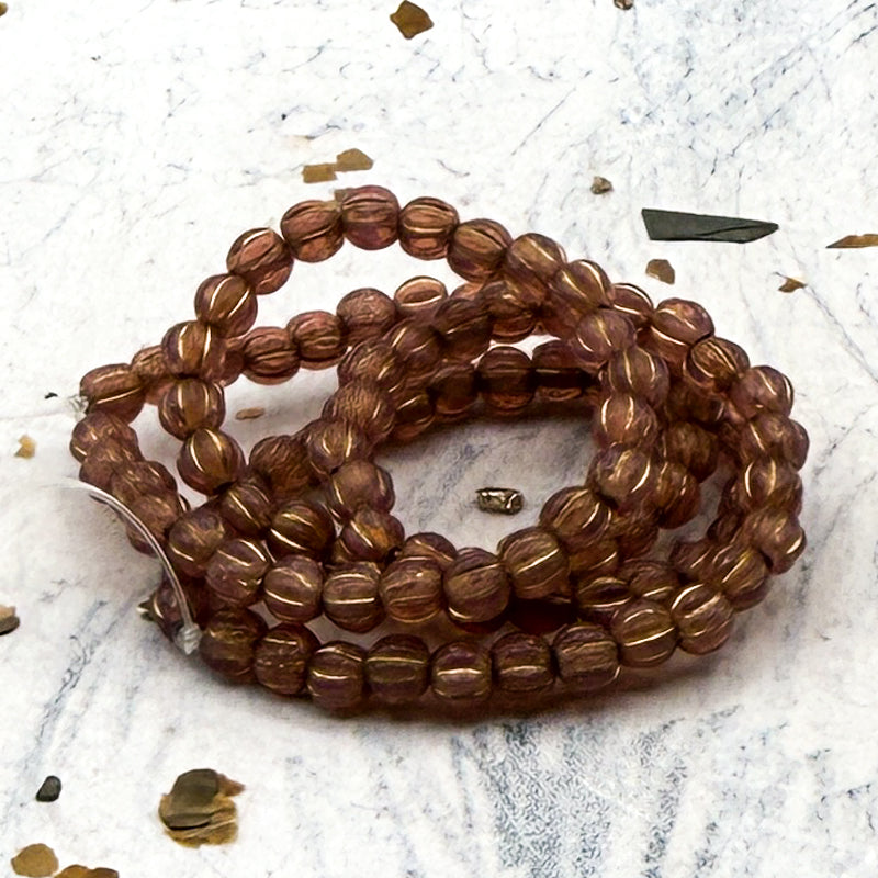 3mm Melon Dark Dusty Rose with a Gold Wash Bead Strand
