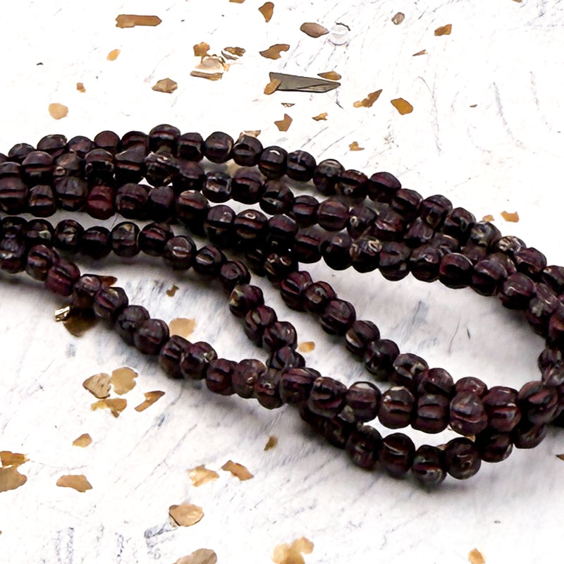 3mm Melon Black with a Picasso Finish Bead Strand