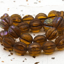 Load image into Gallery viewer, 10mm Amber with Matte and AB Finishes with a Metallic Brown Wash Faceted Melon Bead Strand
