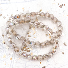 Load image into Gallery viewer, 6mm Transparent with Beige Wash and AB Finish Faceted Melon Bead Strand
