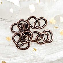 Load image into Gallery viewer, 6mm Textured Antique Copper Oval Jump Ring Set - 12pcs
