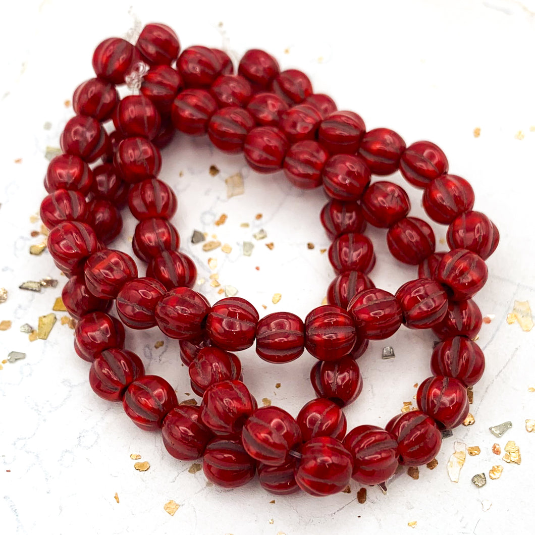 6mm Ruby Red with Bronze Wash Large Hole Melon Bead Strand