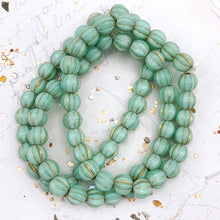 Load image into Gallery viewer, 6mm Mint with Gold Wash Large Hole Melon Bead Strand
