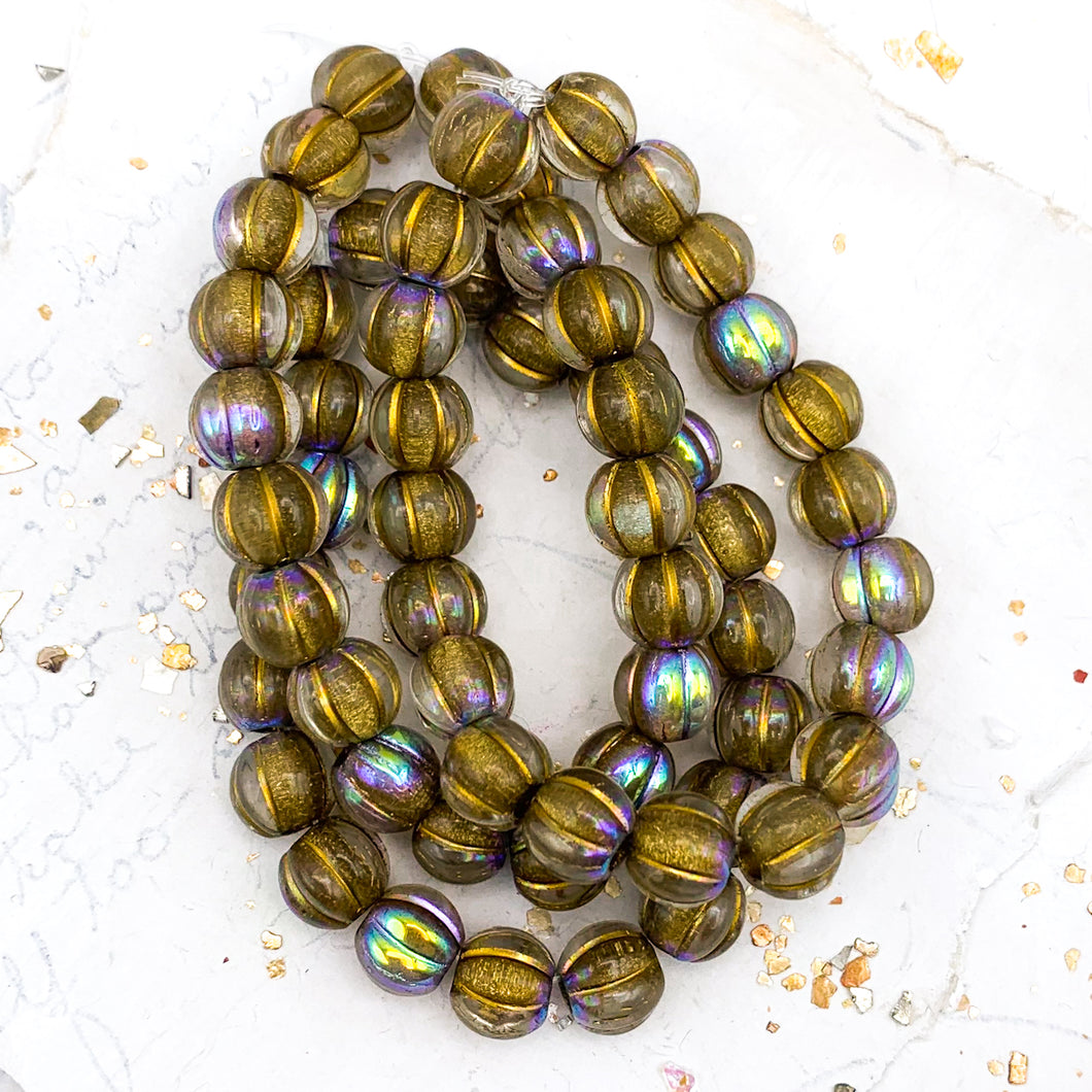 8mm Transparent Glass with AB Finish and a Gold Wash Large Hole Melon Bead Strand