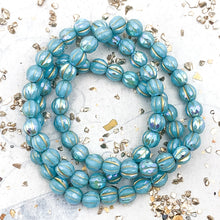 Load image into Gallery viewer, 6mm Sky Blue with Rainbow AB Finish and Gold Wash Faceted Melon Bead Strand
