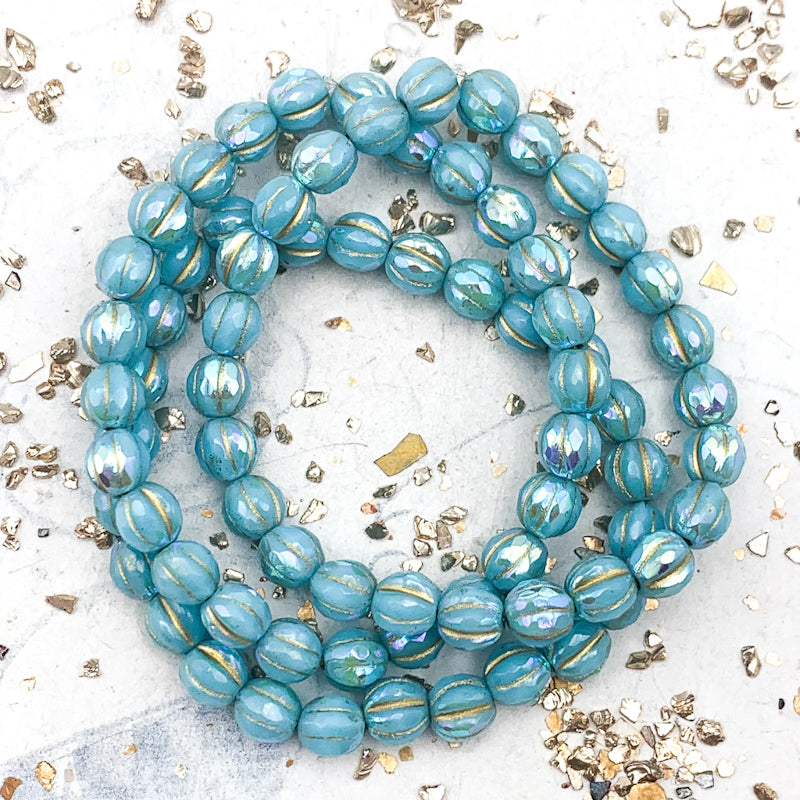 6mm Sky Blue with Rainbow AB Finish and Gold Wash Faceted Melon Bead Strand