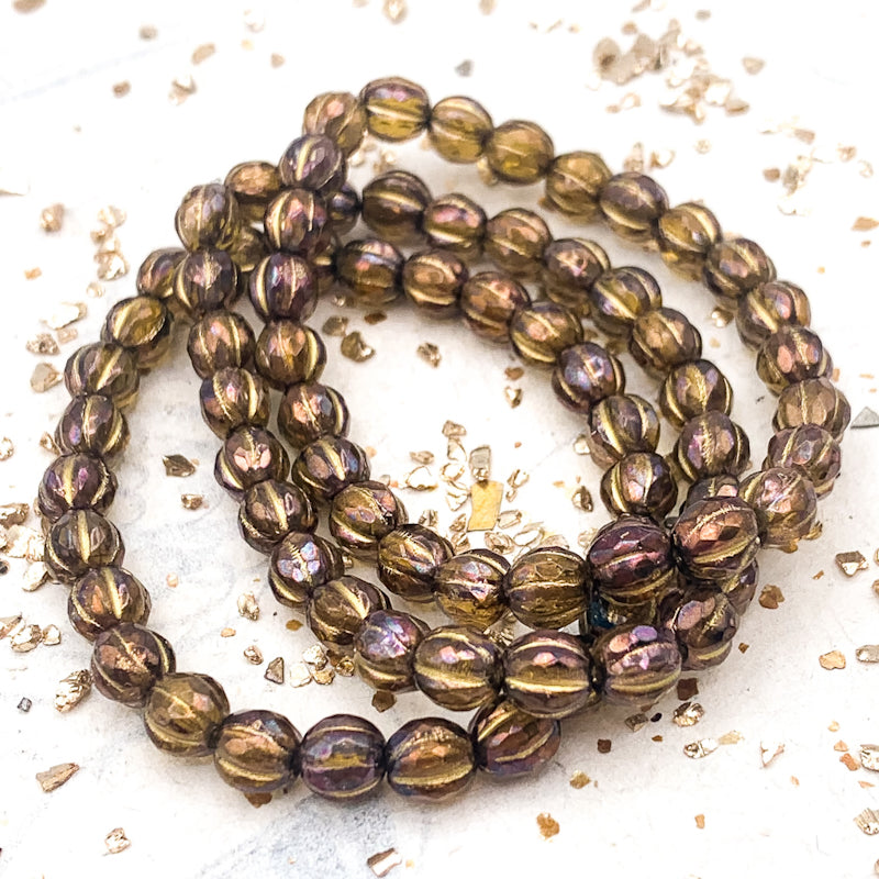 6mm Olive with Luster Finish and Gold Wash Faceted Melon Bead Strand