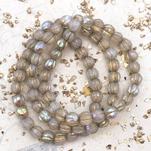 Load image into Gallery viewer, 6mm White with Rainbow AB Finish and Gold Wash Faceted Melon Bead Strand
