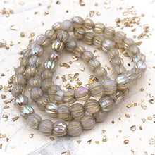 Load image into Gallery viewer, 6mm White with Rainbow AB Finish and Gold Wash Faceted Melon Bead Strand
