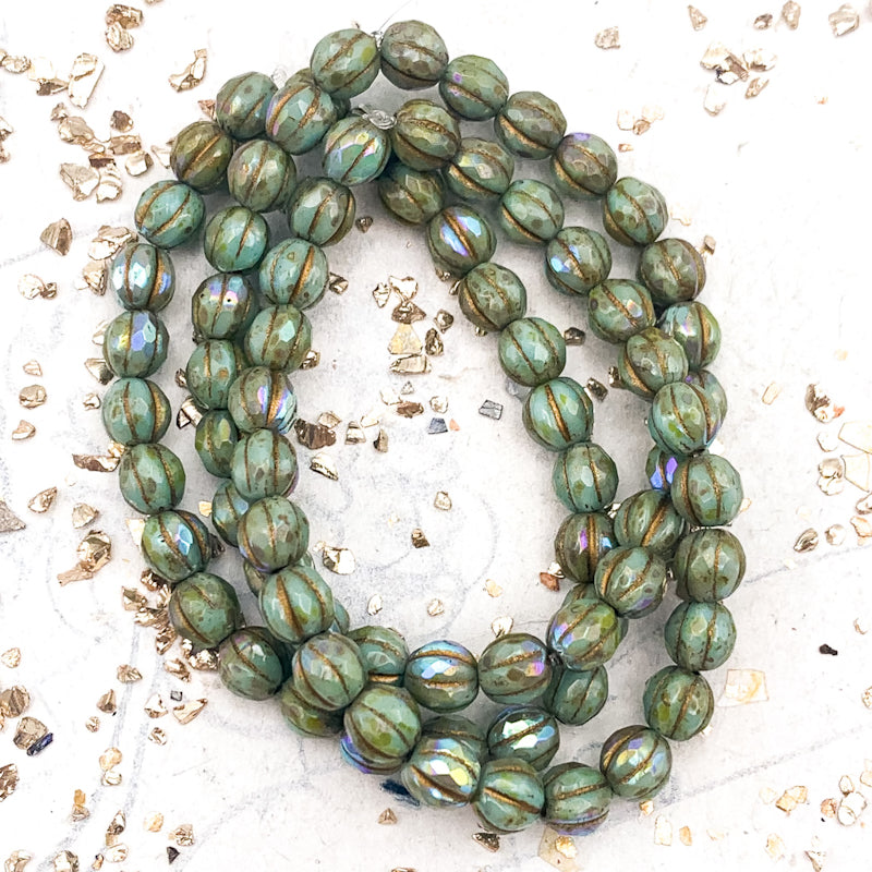 6mm Tea Green with Picasso and AB Finishes and Gold Wash Faceted Melon Bead Strand