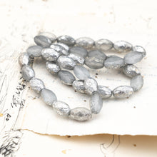 Load image into Gallery viewer, 12x8mm Etched Grey with Silver Finish Faceted Oval Bead Strand
