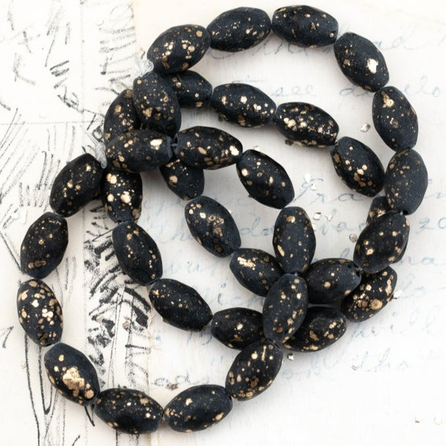 12x8mm Black with a Matte and Gold Finish  Faceted Oval Bead Strand