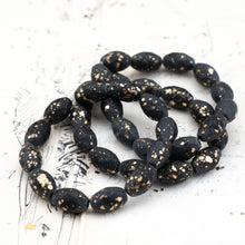 Load image into Gallery viewer, 12x8mm Black with a Matte and Gold Finish  Faceted Oval Bead Strand
