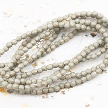 Load image into Gallery viewer, 3mm Etched Pale Stone with Gold Wash Fire-Polished Faceted Round Bead Strand
