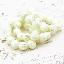 Load image into Gallery viewer, 10mm Ivory with a Luster and AB Finish Faceted Melon Bead Strand
