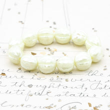 Load image into Gallery viewer, 10mm Ivory with a Luster and AB Finish Faceted Melon Bead Strand
