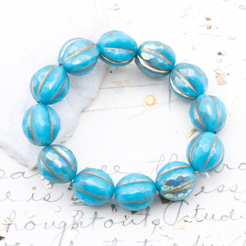 10mm Sky Blue with an AB Finish and a Gold Wash Faceted Melon Bead Strand