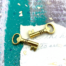 Load image into Gallery viewer, Golden Skeleton Key Charm Pair
