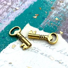 Load image into Gallery viewer, Golden Skeleton Key Charm Pair
